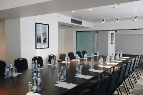 a large conference room with a long table and chairs at Holiday Inn - Tbilisi by IHG in Tbilisi City