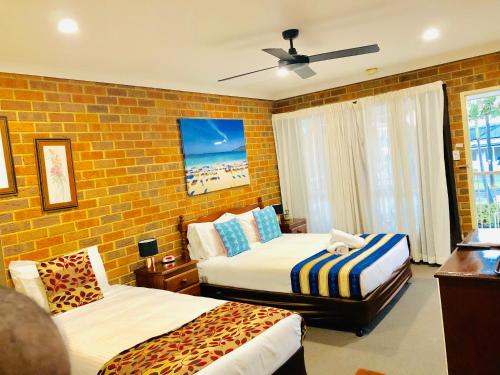 Ένα ή περισσότερα κρεβάτια σε δωμάτιο στο Aussie Rest Motel