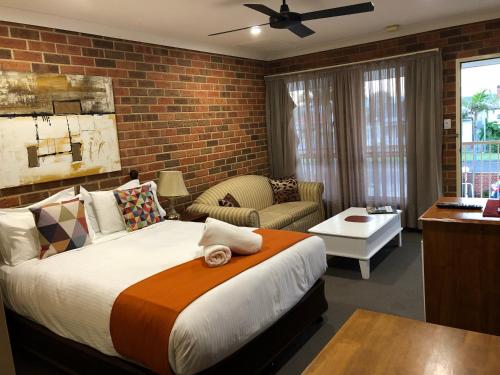 Ένα ή περισσότερα κρεβάτια σε δωμάτιο στο Aussie Rest Motel
