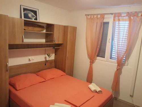 Ένα ή περισσότερα κρεβάτια σε δωμάτιο στο Apartments Limuni