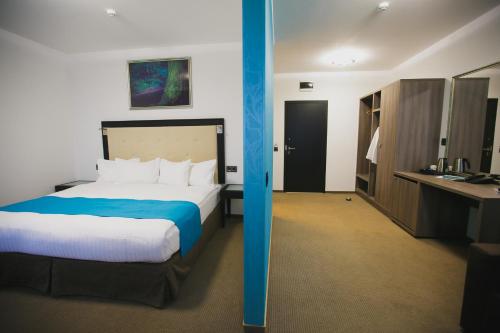 Ένα ή περισσότερα κρεβάτια σε δωμάτιο στο Primera Dru Hotel&Spa