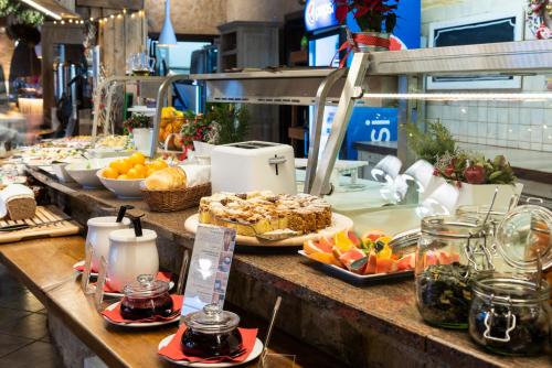 a buffet line with different types of food on it at Vital&Spa Resort Szarotka in Duszniki Zdrój