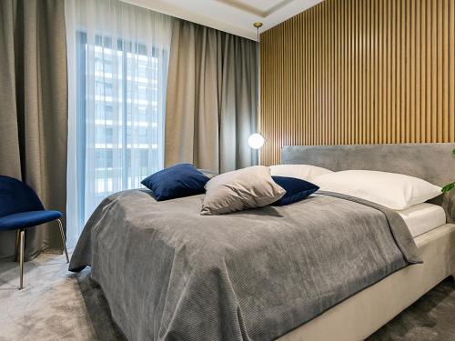Ένα ή περισσότερα κρεβάτια σε δωμάτιο στο VacationClub - Baltic Park Fort Apartament E.303