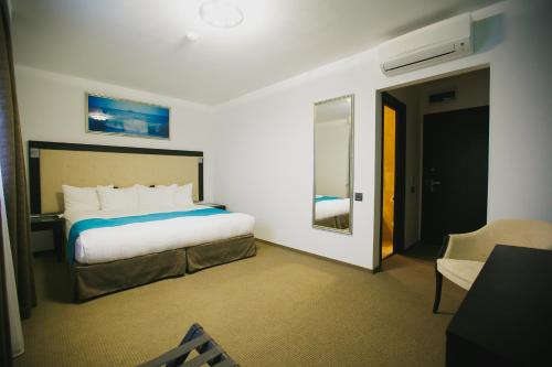 Ένα ή περισσότερα κρεβάτια σε δωμάτιο στο Primera Dru Hotel&Spa