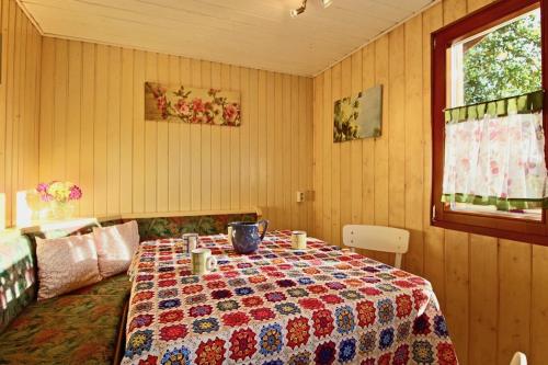 a room with a table with a quilt on it at Villa Kunterbunt in Meßkirch