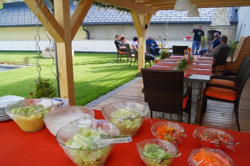 a table with bowls of food on top of it at Sport Garni Kapplerhof – Ischgl/Kappl in Kappl