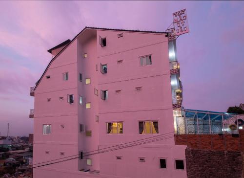 a pink building with lights on top of it at MrLee Dalat House in Da Lat