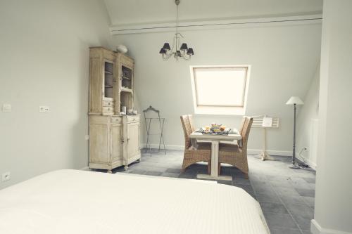 Postel nebo postele na pokoji v ubytování B&B In de velden