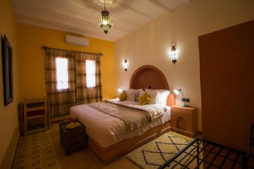 Un ou plusieurs lits dans un hébergement de l'établissement Hassilabiad Appart Hotel
