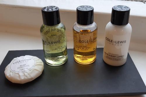 three bottles of essential oils on a black table at The Masons Arms in Harrogate