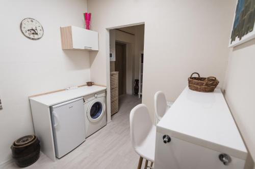 a laundry room with a washer and dryer in it at U svaté Ludmily in Litoměřice