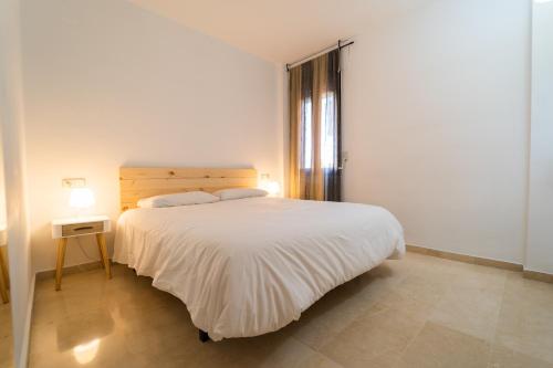 Ένα ή περισσότερα κρεβάτια σε δωμάτιο στο Apartamento Almunia