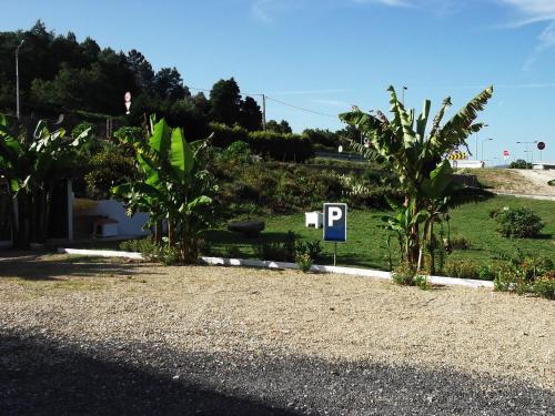 a parking sign on the side of a road at Hotel Minho Belo in Vila Nova de Cerveira