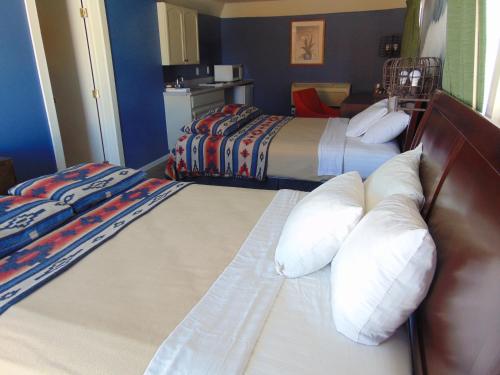 a hotel room with two beds with pillows at Bryce Canyon Resort in Bryce Canyon