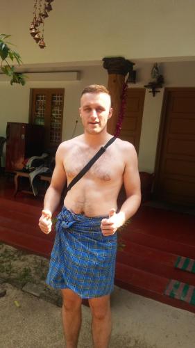 a shirtless man wearing shorts and a belt at Marari Nadiya in Mararikulam