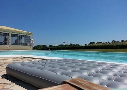 a large swimming pool with a large swimming pool at Casamia in Senigallia