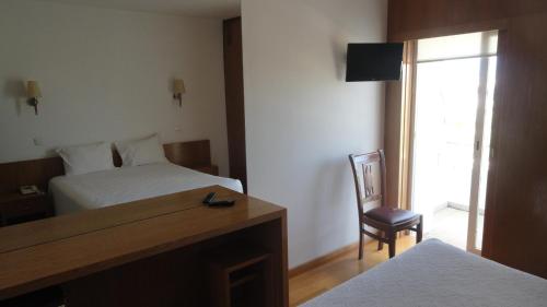 Postel nebo postele na pokoji v ubytování Hotel O Mirandes