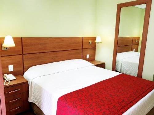 Cama o camas de una habitación en Hotel Pousada Clássica