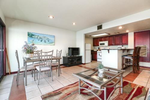a kitchen and living room with a table and chairs at Resort Attractions in Willis