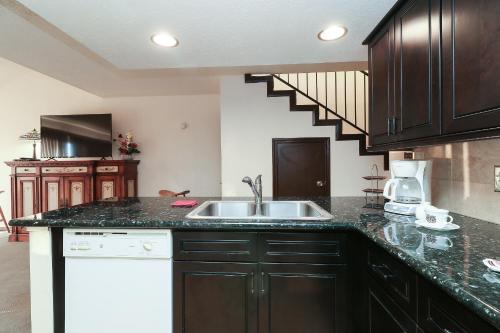 a kitchen with a sink and a counter top at Resort Attractions in Willis