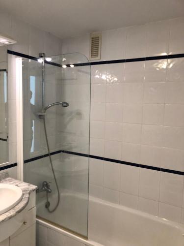 a bathroom with a glass shower with a sink at La Siesta de Mijas Golf 174 in Fuengirola