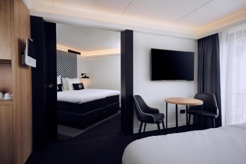 Postel nebo postele na pokoji v ubytování Gr8 Hotel Bodegraven