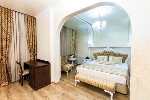 Postel nebo postele na pokoji v ubytování Iberia Palace Hotel