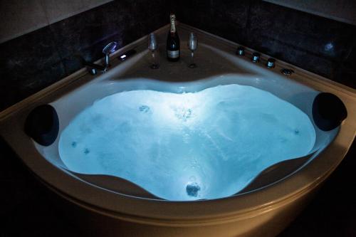 a bath tub in the shape of a heart at Iberia Palace Hotel in Zugdidi