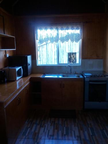 Kuchyň nebo kuchyňský kout v ubytování Cabaña Verónica