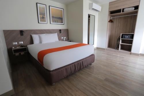 a bedroom with a large bed in a hotel room at Casa Andina Standard Trujillo Plaza in Trujillo