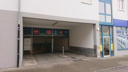 an entrance to a building with a parking garage at City Hotel in Schopfheim