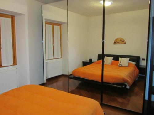 En eller flere senge i et værelse på Casa Soldino