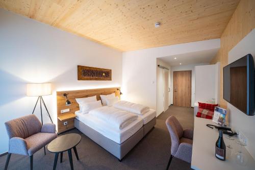 Postel nebo postele na pokoji v ubytování Weinhotel Pfeffer & Salz