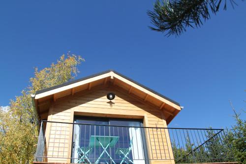 a building with a roof with a window at Clos Shambhala-Chalet d'hôtes in Saint-Jean-Saint-Nicolas