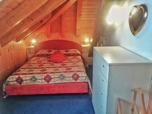 Ένα ή περισσότερα κρεβάτια σε δωμάτιο στο Casa Vacanza Tonale