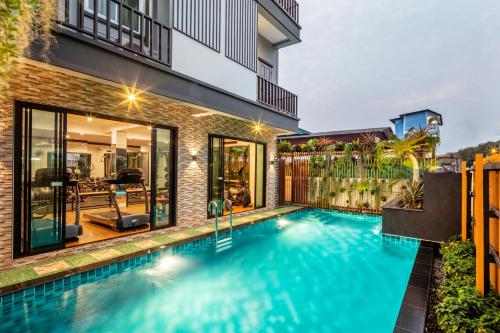 an image of a swimming pool in a house at Penyos Suite in Bangkok