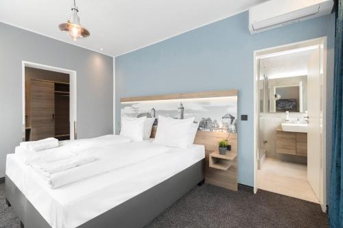 Postel nebo postele na pokoji v ubytování Hotel dasPaul