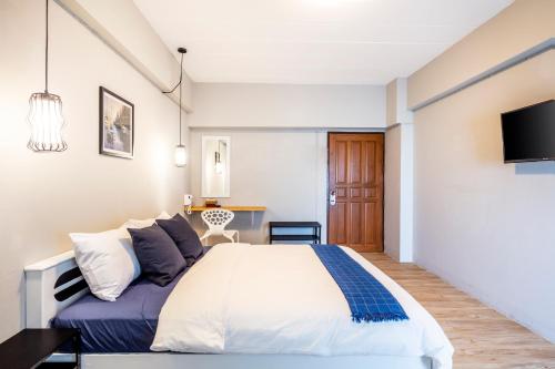 Ένα ή περισσότερα κρεβάτια σε δωμάτιο στο Penyos Service Apartment