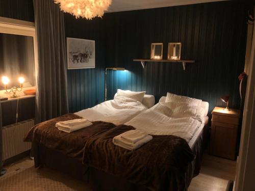 Postel nebo postele na pokoji v ubytování Henning Ski Lodge