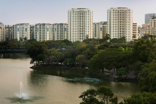 a view of a river in a city with tall buildings at Shangri-La Serviced Apartments, Yangon in Yangon