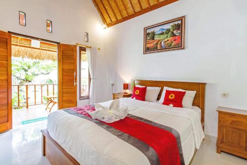 Ένα ή περισσότερα κρεβάτια σε δωμάτιο στο Rama Homestay