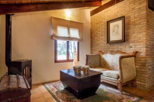 a living room with a couch and a fireplace at Ca Carmela, casa con Encanto con Piscina "Parque Natural Sierra Calderona"cerca Garbi, Good Vives! in Valencia
