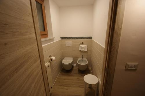 a small bathroom with a toilet and a bidet at Hotel Europa in Bardonecchia