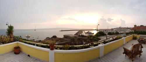 a view of the ocean from a balcony at Villarolu in Portoscuso