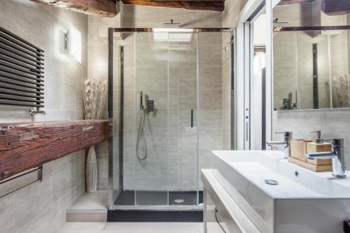 a bathroom with a shower and a sink at Ponte Milvio Luxury House in Rome