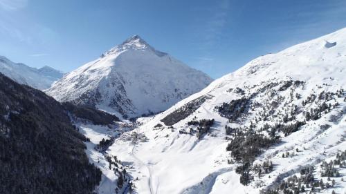 a mountain covered in snow with a valley at Hotel Alt Vent Tyrol in Vent