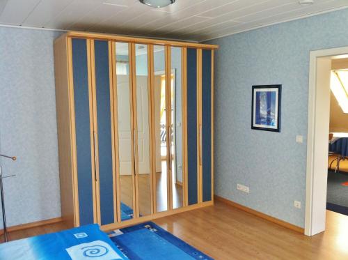 a room being remodeled with a wall of glass at Ferienwohnung Blau in Schweigen-Rechtenbach