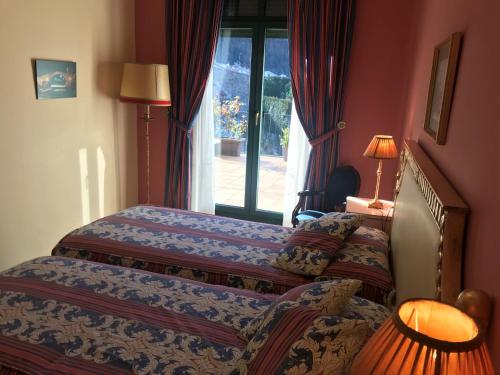 Кровать или кровати в номере Hotel de Camprodón