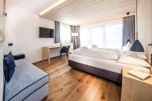 Postel nebo postele na pokoji v ubytování Hotel Garni Broi - Charme & Relax