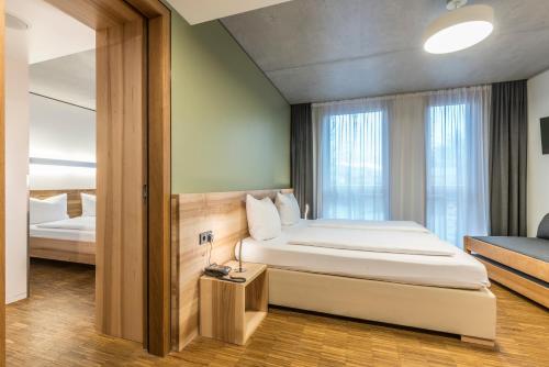Katil atau katil-katil dalam bilik di Green City Hotel Vauban